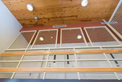 HOME SWEET HOME: Rooms line the second floor of SLO’s juvenile hall. Most kids prefer to have a roommate, but high-risk kids often have to bunk solo. - PHOTO BY KAORI FUNAHASHI