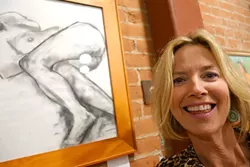 CLOTHING OPTIONAL: Christine Cortese poses by one of her charcoal drawings in Assets, a studio that teaches barre, as in ballet barre, workouts. The studio is also full of Cortese’s figurative oil paintings. - PHOTO BY GLEN STARKEY