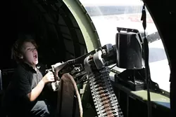 LET’S PRETEND : Jaden takes aim at imagined German fighter planes from the belly of a B-17.