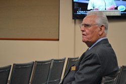 A CHAPLAIN CHALLENGED:  Pismo Beach City Chaplain Dr. Paul Jones, pictured here at the Nov. 5 city council meeting, is one of the targets of a recently filed 252-page lawsuit that challenges the city&rsquo;s prayer practices at government meetings. - PHOTO BY RHYS HEYDEN