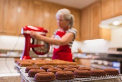 HOMEMADE FOR YOU:  Carol Radike prepares a batch of Doughkies in her home kitchen. Under the Cottage Food Act, Radike started a business selling specialty cookies made at home, instead of in a commercial kitchen. - PHOTO BY KAORI FUNAHASHI