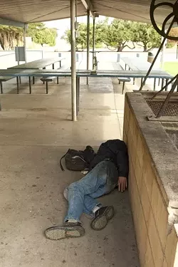 SERVICE CENTER : The picnic tables at Lila Keiser Park are the only decent place to serve meals to the hungry, but many families object to the presence of vagrants at the park. - PHOTOS BY STEVE E. MILLER
