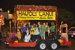 PEANUTS GALLERY: The entire group congregates on our grand float minutes before our imminent demise. Er … I mean, our dancing debut. - PHOTO BY ALEX ZUNIGA