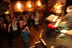 THE CROWD LOVES ‘EM! : About 300 fans packed into Downtown Brew last Saturday to see the Damon Castillo Band take top honors as Best Band. - PHOTO BY STEVE E. MILLER