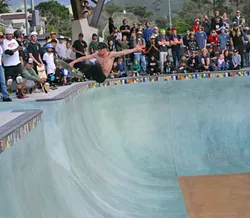 BIG AIR!: Some fearless pro skaters showed the crowd how it was done in the park’s biggest bowl during the grand opening on Feb. 28. - PHOTO BY GLEN STARKEY