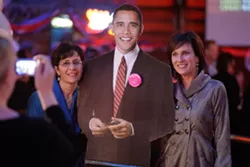 INAUGURAL BALL : Simone Viola (right) and Pirtza Abuan (left) pose with President Obama's cutout at The Graduate. - PHOTO BY STEVE E. MILLER