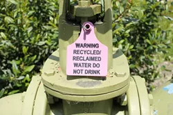 FINE FOR WINE? : Warnings such as this one adorn areas where SLO City irrigates with recycled water. - PHOTO BY STEVE E. MILLER