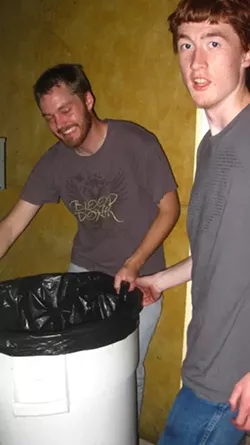 CAUGHT IN THE ACT : Pro tip: Big trash cans look like a good place to hide, but getting inside can be loud, unbalanced, and downright perilous. Thanks Chris White-Sanborn, for keeping me from breaking my handsome face. - PHOTO BY MAEVA CONSIDINE