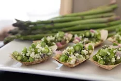 SMELL THE GREEN: Spring asparagus, harvested at the peak of the season, is among the many farm fresh foods served at the Earth Day Food & Wine Festival. - PHOTO COURTESY OF THE VINEYARD TEAM