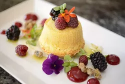 BERRY DELICIOUS: Desserts at Willow include this olive oil cake with goat cheese coulis, raspberry gel, local fresh berries, braised pistachio, micro herbs, and edible flowers. - PHOTO BY STEVE E. MILLER