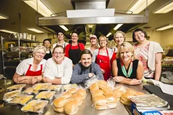 THE CREW: New Times staff writer Rhys Heyden, center, is surrounded by his culinary superiors and colleagues for the day at San Luis Obispo’s Laguna Middle School. - PHOTO BY HENRY BRUINGTON