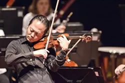 LEADER OF THE PACK: Music Director Scott Yoo is both a renowned conductor and performer. He began playing violin at age 3 and has since conducted all over the world, in places as varied as Chicago, London, Mexico, and Japan. - PHOTO BY BRIAN P. LAWLER