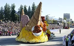 BYE-BYE, PASADENA!: Cal Poly universities’ float makes its way down the 5.5-mile parade route with a gummy bear waving goodbye to about 700,000 live spectators. - PHOTO BY TOM ZASADZINSKI; COURTESY OF CAL POLY SLO & POMONA