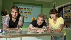 POLLY WANT SOME SKIN ART? : After an eight-year search, Bob McNure (center) and his wife, Claire Gorrindo (right), were able to open up their own tattoo shop, Painted Pirate Ink in Morro Bay. Along with Jeremiah Adams (left), they’re still putting the finishing touches on the shop, but clients are already welcome. - PHOTO BY STEVE E. MILLER