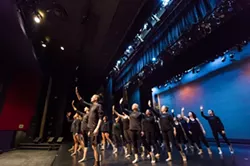 ARMS WIDE OPEN: The Orchesis Dance Company members rehearse their finale number, set to the music of Mumford & Sons and choreographed by guest artist Mike Esperanza. - PHOTO BY KAORI FUNAHASHI