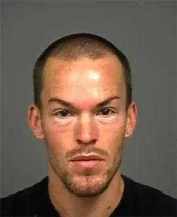 WILD NIGHT : San Luis Obispo resident Samuel Dabill is accused in a string of vandalism and burglary events along a stretch of Marsh Street on Nov. 27, believed to have caused thousands of dollars in damage and scared the crap out of pedestrians and salon employees. - MUGSHOT COURTESY OF SLOPD