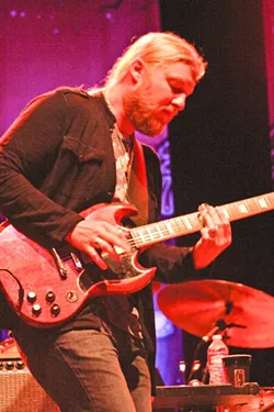 DEREK TRUCKS: Using a glass slide, Derek Trucks lit up the night with his amazing guitar work. - PHOTO BY ANNA STARKEY