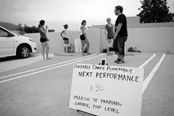 PDA : One of the stops along the way for Portable Dance Assembly was the top level of the Marsh Street parking garage, where the dancers performed while cars drove by. - PHOTO BY STEVE E. MILLER