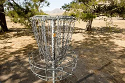SLIP A DISC : The SLO Throwers, a local disc-golf club, has been instrumental in setting up disc golf courses around San Luis Obispo County, including this one at Laguna Lake, - PHOTO BY STEVE E. MILLER