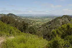 SHIFTING PERSPECTIVE : If approved, this will be the view of Huasna Valley from Excelaron’s Pad 2 drilling site. But project officials believe residents down below won’t see much of the drilling operation. - PHOTO BY STEVE E. MILLER
