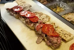 JUICY : Thick slabs of bright red, fresh tomatoes top luscious slices of roast beef.