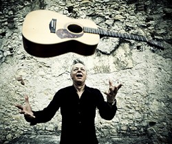 MAGIC FINGERS:  Amazing finger style guitarist Tommy Emmanuel returns to the PAC for an evening of acoustic magic on Jan. 21. - PHOTO BY SIMONE CECCHETTI