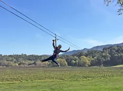 ZIP IT GOOD: Flavor columnist Hayley Thomas flies through the air with the greatest of ease. - PHOTO BY CHRISTOPHER WEIR
