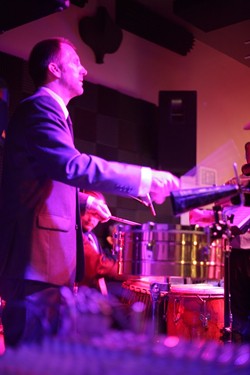 HE&rsquo;S GOT THE BEAT :  De La Bahia percussionist Mike Raynor and the rest of the band bring sultry Latin salsa music to Steynberg Gallery on June 18. - PHOTO BY GLEN STARKEY