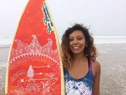 SURF IN STYLE : Nipomo artist and yogi Vanessa Venegas hand paints surfboards and skateboards. This surfboard was inspired by the sacral chakra, one of the body’s energy centers associated with creativity and zest for life. - PHOTO BY RYAH COOLEY