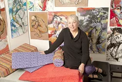 IN LIVING COLOR : Artist Joanne Ruggles, pictured, often renders the human form in brilliant colors, though her latest body of work is dominated by shades of black, white, and grey. - PHOTO BY STEVE E. MILLER