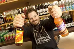 SUGAR DADDY : Business owner Josh Morrow works seven days a week to get Rocket Fizz Soda Pop and Candy Shop off the ground, but his wife assumes candy duties in the afternoons so he can spend quality time with their two kids. - PHOTO BY STEVE E. MILLER