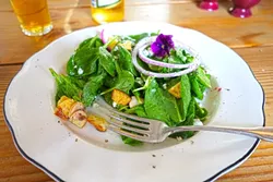 HALF-EATEN SALAD: Oops, I did it again with this baby spinach salad with pickled free-range eggs and warm bacon dressing. - PHOTO BY GLEN STARKEY