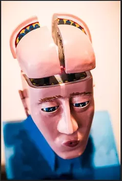 BRAIN TEASER: Turn a lever and you can blow this man’s mind in Rick Davis’ kinetic sculpture. - PHOTO BY HENRY BRUINGTON