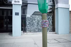 KNIT TAG : Even a humdrum parking meter looks a little cozier with knitted apparel. - PHOTO BY STEVE E. MILLER