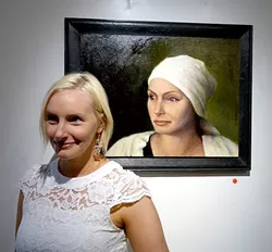 AMERICAN BEAUTY: Clare Kennedy musters up the bemused expression of her portrait. - PHOTO BY GLEN STARKEY