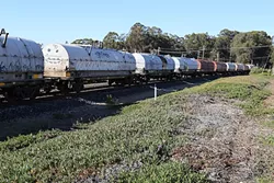 GET ’EM OUT: About 100 idle rail cars have been sitting in Grover Beach for nearly a year, and city officials are concerned that they are a safety hazard. - PHOTO BY DYLAN HONEA-BAUMANN