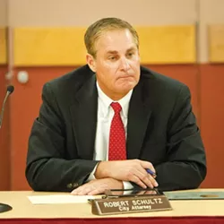 NO LOVE LOST: Long-time Morro Bay City Attorney Rob Schultz sat solemnly and silently at the onset of what would become a marathon special closed session meeting on his future with the city. - PHOTO BY STEVE E. MILLER