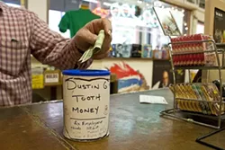 MAKE ’EM SMILE : To donate money to Dustin Garrison’s dental fund, drop by Urban Outfitters or Boo Boo Records - PHOTO BY STEVE E. MILLER