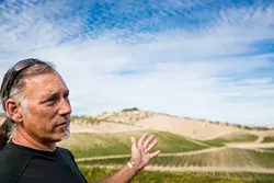 DRAWING THE LINE: Adelaida residents like Gianni Manucci (pictured), owner of Wild Coyote Estate Winery and Bed and Breakfast, want less development and event-hosting at the wineries in the region. - FILE PHOTO BY KAORI FUNAHASHI