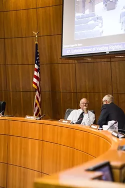 AGREE TO DISAGREE: Bruce Gibson (right) talks to Frank Mecham (left) during a break before the Supervisors discussed the proposed Paso water district. In a deciding vote Mecham changed his position from previous votes, thereby shifting the Supervisors’ position on a bill currently going through the state senate. - PHOTO BY HENRY BRUINGTON