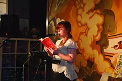 ALMOST POETRY: New Times managing editor Ashley Schwellenbach read a passage from her debut young adult novel Scourge of the Righteous Haddock. - PHOTO BY COLIN RIGLEY