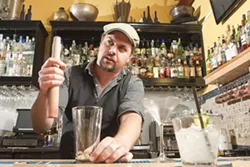 BARTENDER ROULETTE: Novo Bar Manager Matt Hanson encourages his staff to be creative and concoct their own exclusive cocktails in what’s known as the Bartender’s Roulette. - PHOTO BY STEVE E. MILLER