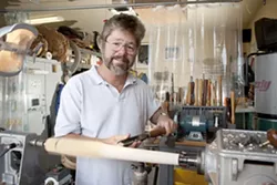THE IMPORTANCE OF BEING RUDE : Wood-turner Michael Rude spend time amid a vast array of sharp objects. - PHOTO BY STEVE E. MILLER