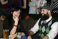 BEAUTY AND THE BEAST : Ms. Hotness (aka—Darci Spiker) chats it up with Embodiment artist and enormously bearded San Luis Art Supply owner Neal Breton. - PHOTO BY GLEN STARKEY