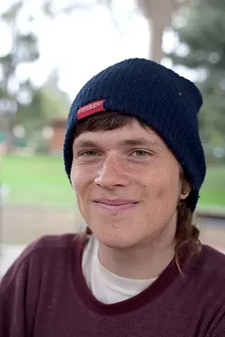 DO GOODER : Trevor Barrick is one of several young 20-somethings involved in the local grassroots movement Food Not Bombs, which feeds the hungry Friday evenings and Sunday afternoons in two SLO Town parks. - PHOTO BY GLEN STARKEY