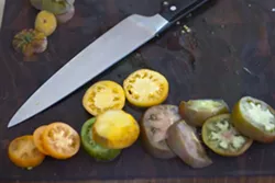 MULTITUDE OF USES: Chefs from various SLO County restaurants showed off their tomato dishes to the media in advance of the Ode To Tomato event. Shown here are heirloom tomatoes from the Sycamore Springs private garden. - PHOTO BY STEVE E. MILLER