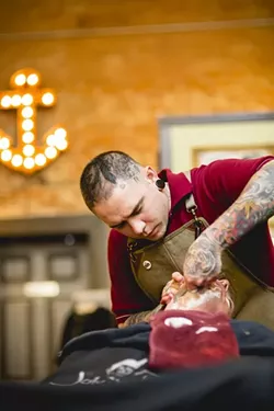 TWO BITS?: Sammy Mejia is already proving to be a popular local choice for haircuts and shaves at The Ritual. - PHOTO BY HENRY BRUINGTON