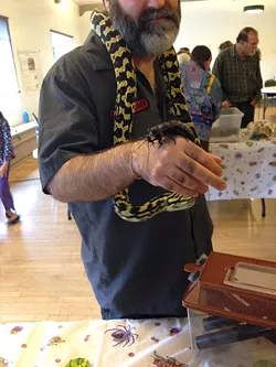 THE BEST OF FRIENDS?: Brian, pictured, juggles a python and an exotic insect. - PHOTO BY ANNA WELTNER