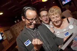 SCORE! : San Luis Obispo Councilman Dan Carpenter—flanked by fellow council members Kathy Smith and Andrew Carter—couldn’t help but bust a little Taekwondo the moment the first preliminary results popped on the screen and he realized that he enjoyed a healthy lead over John Ashbaugh, Kevin Rice, and Matt Strzepeck. - PHOTO BY STEVE E. MILLER