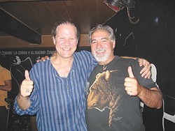 CUBA LIBRE :  Jorge Milan&eacute;s of Los Osos, shown here with musician Pablo Men&eacute;ndez, is planning a trip to Cuba after travel restrictions were eased last month for Cuban Americans. - FILE PHOTO